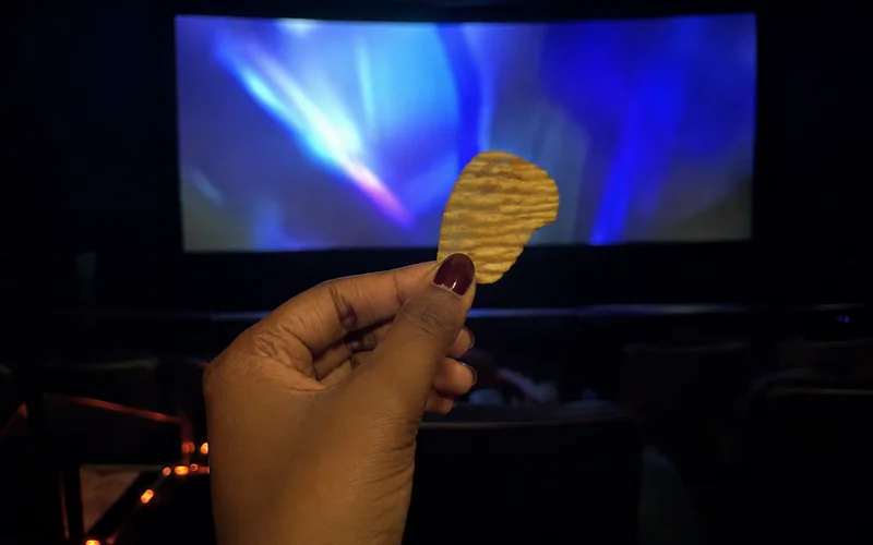 Customer with chips at the cinema