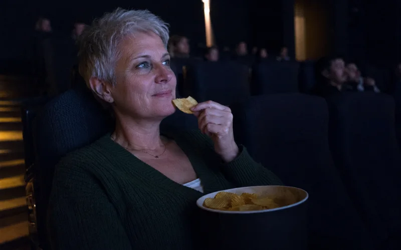 Customer at the cinema with Sour Cream & Onion chips